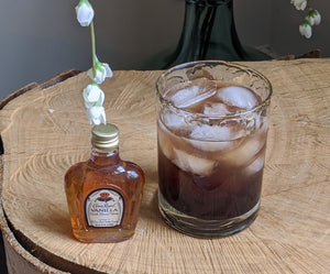 Elderberry Crown Cocktail with Elderberry syrup lady's elderberry syrup, vanilla crown royal, and a honey rim.